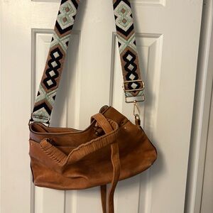 Stylish Tan Leather Bag with Patterned Strap